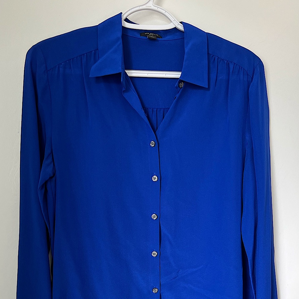 Blue silk button up shirt with collar by Ann Taylor. Size 4.